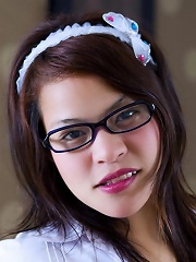 Dar posing as a schoolgirl with glasses